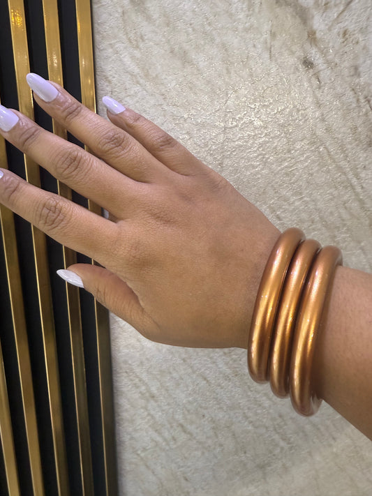 3 bold bronce jelly bangles